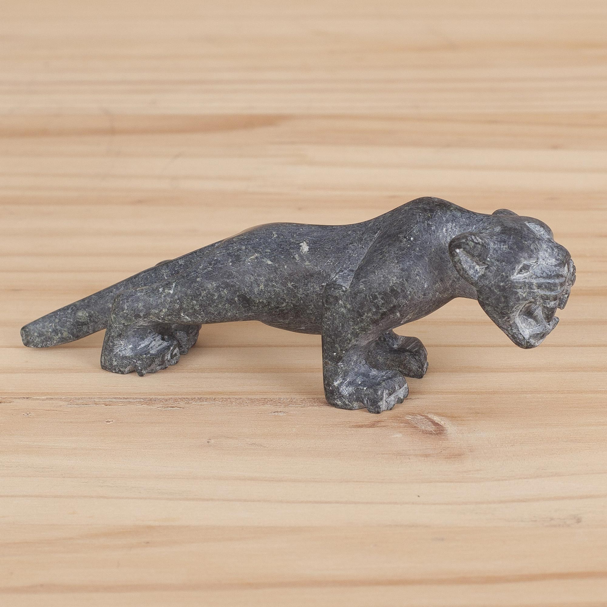 Puma sculpture Handcrafted Serpentine Stone Sculpture of a Puma from Peru artisan profile hand carved Stone Carver descended from Inca Warriors