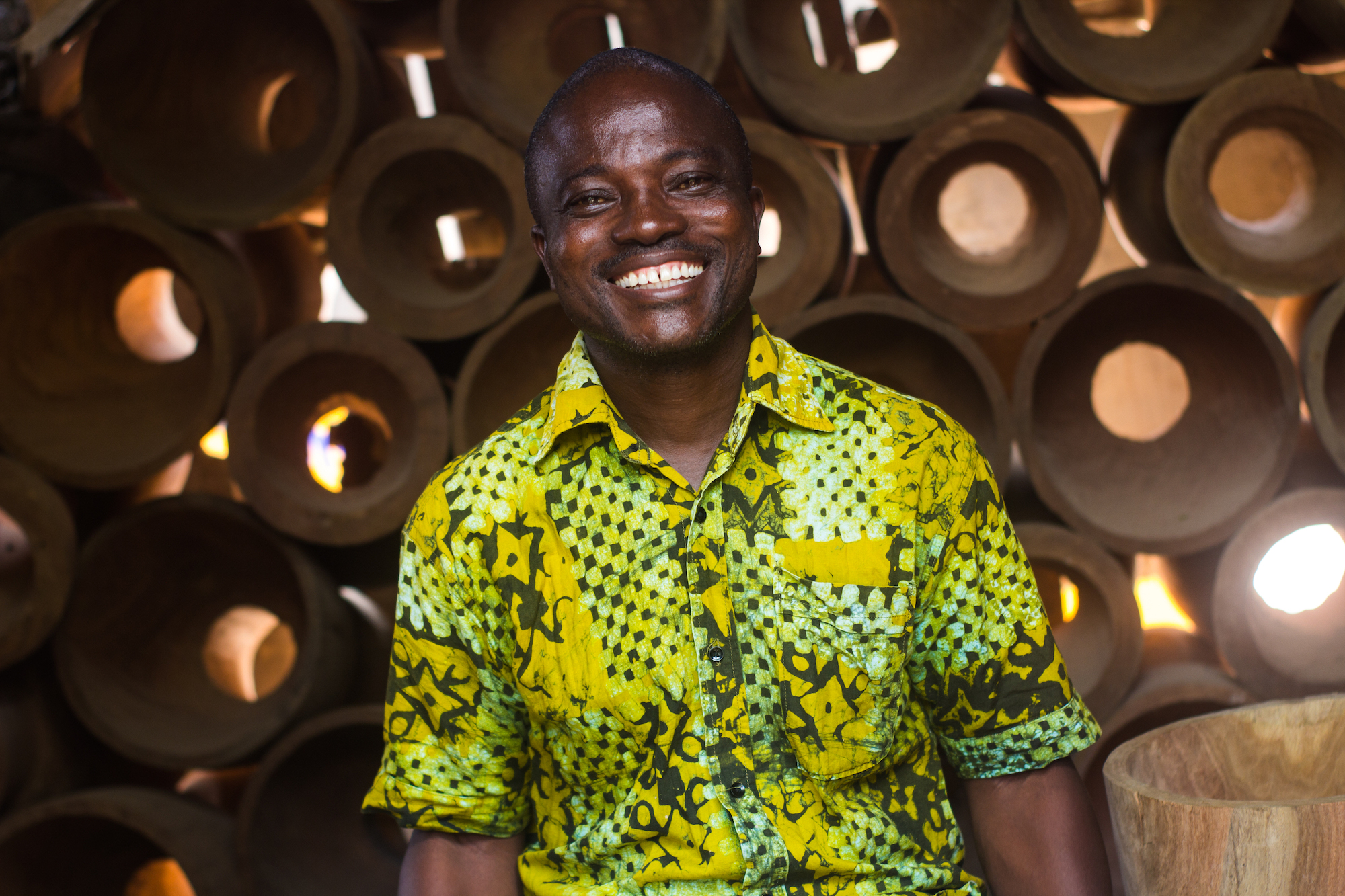 NOVICA artisan, Daniel Asante with drum shells in the background